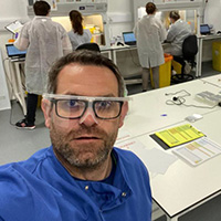 Professor Alan McNally and scientists at work in a laboratory