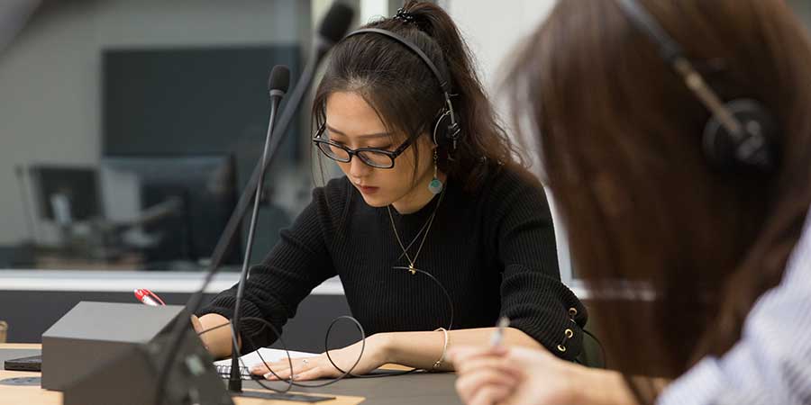 A student working in Birmingham's Interpreting Suite