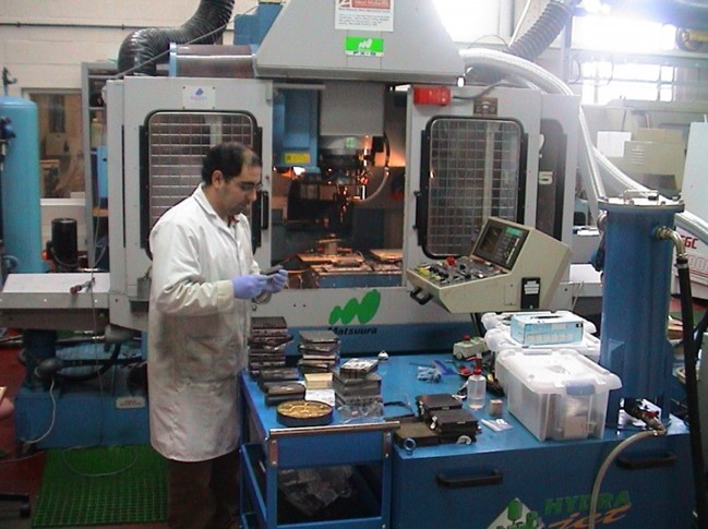 A technician using a multi-axis-machine