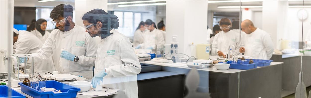 Pharmacy students working in a lab