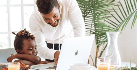 Father working from home with daughter