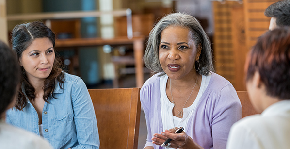 Mature female students having a discussion