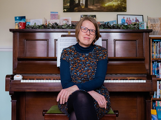 Wendy sitting at the piano