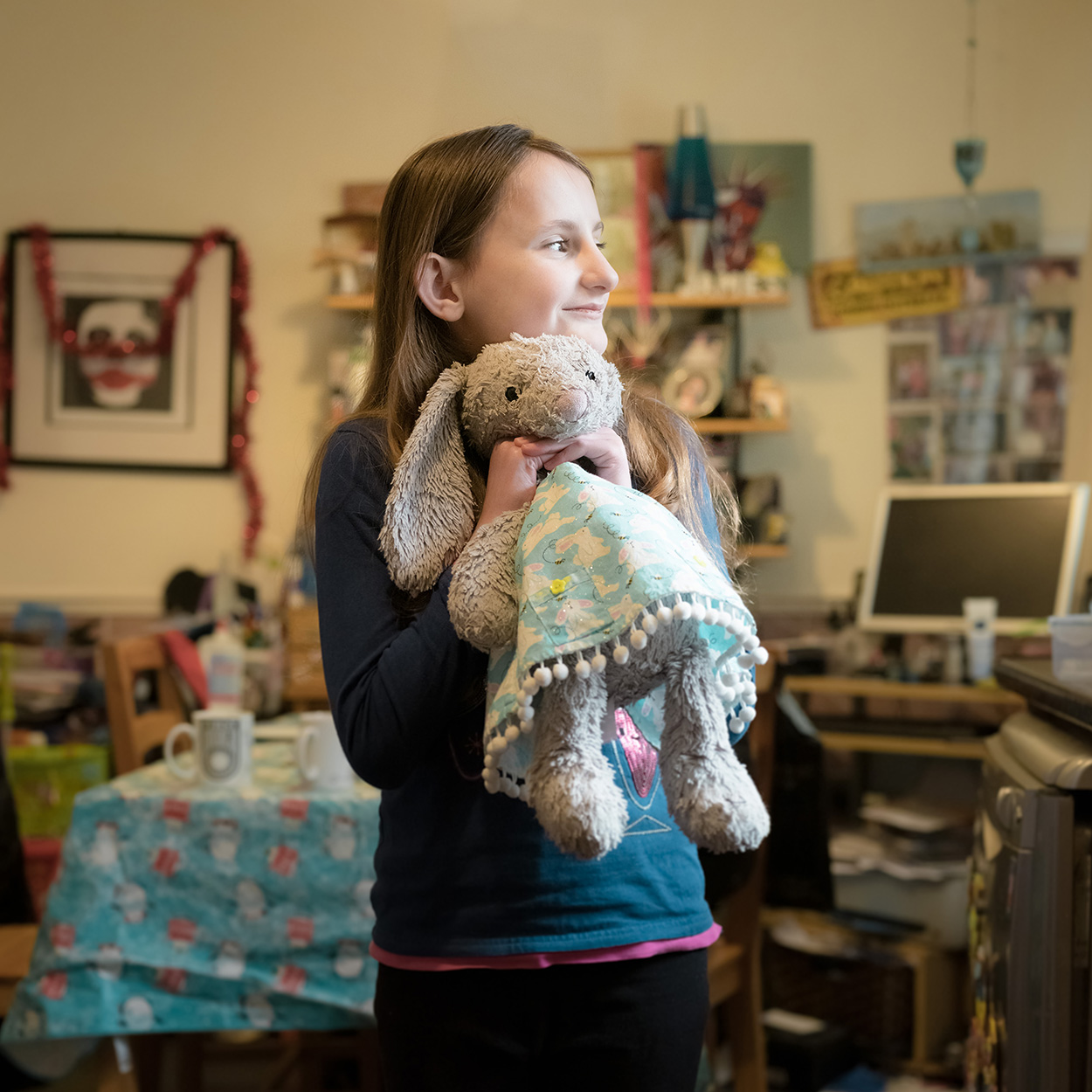Sophie hugging her toy rabbit