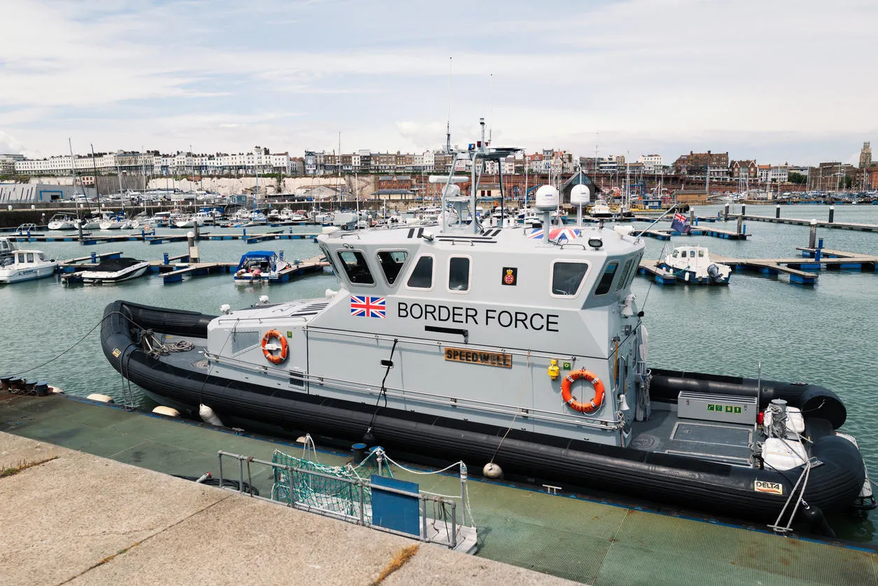 UK Border Force boat in a dock.