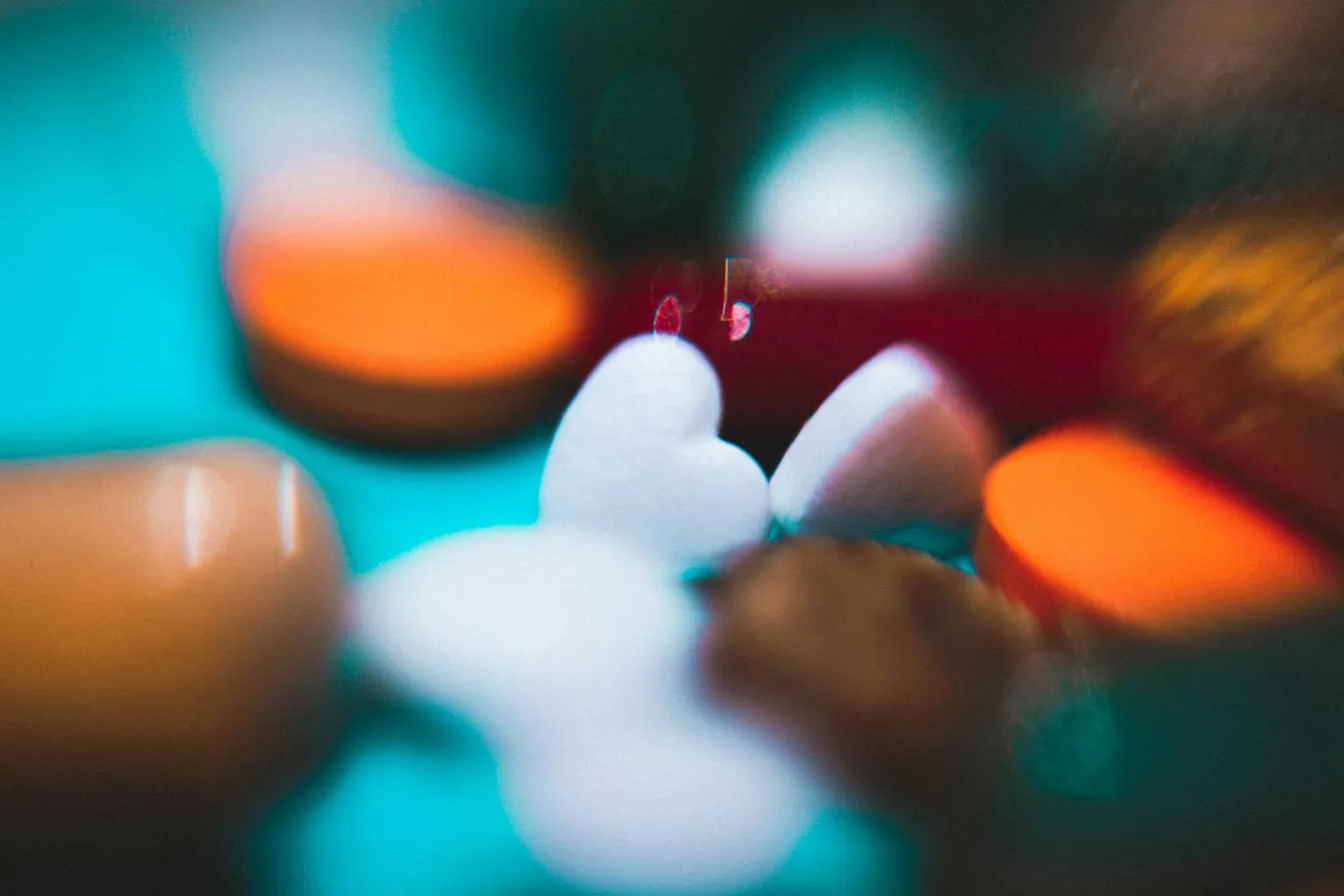 Close up of various medicines including one shaped like a heart