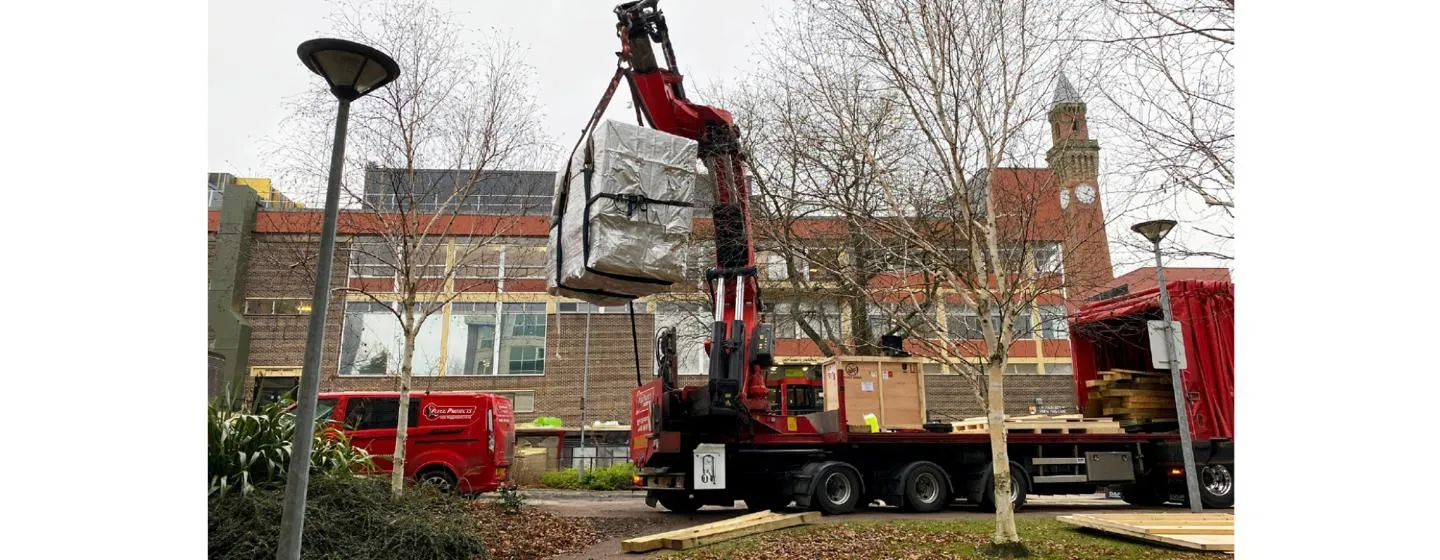 large machine delivered by a mini crane